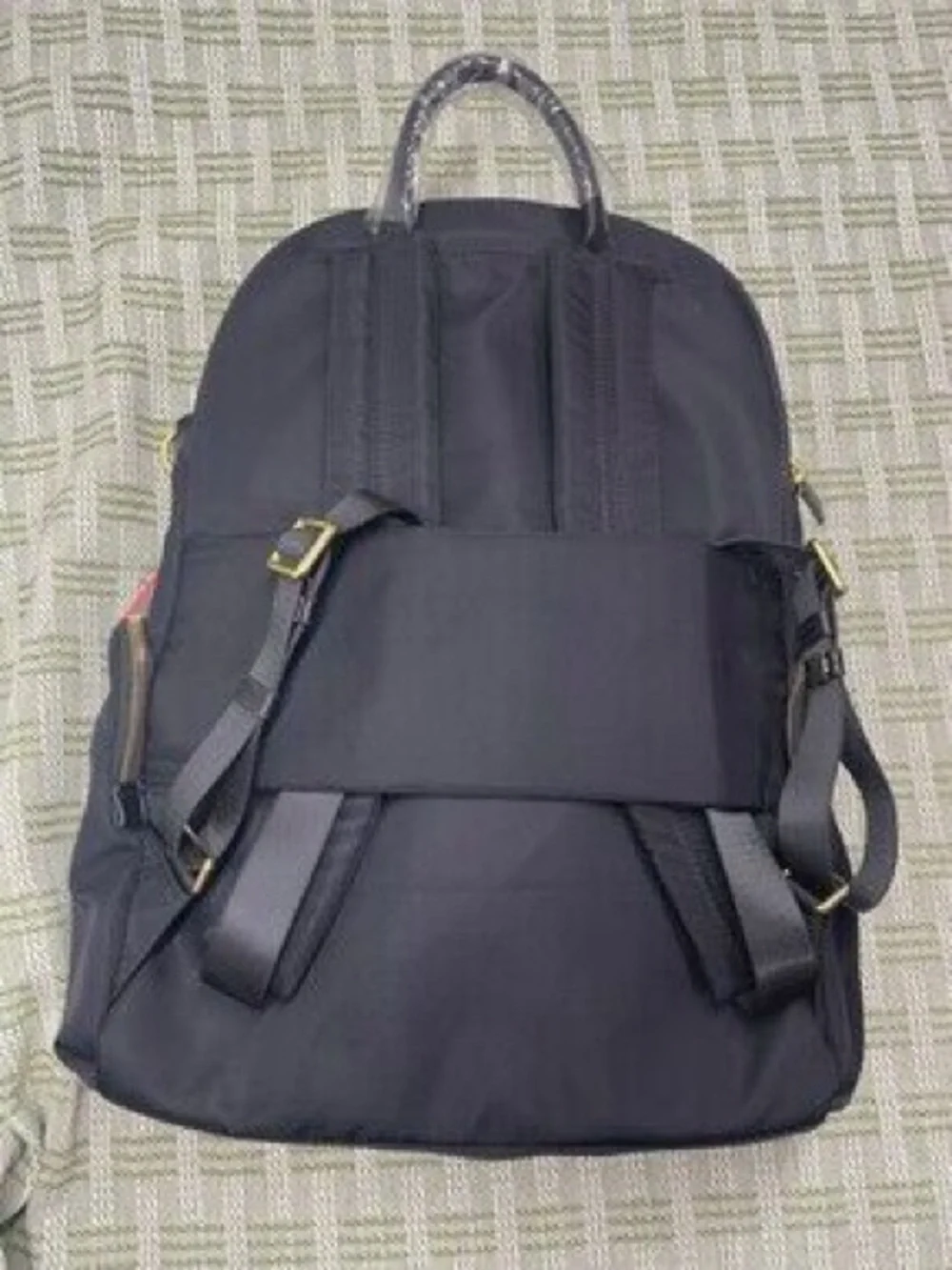 Tumi Black Nylon Backpack with Gold Hardware Accents